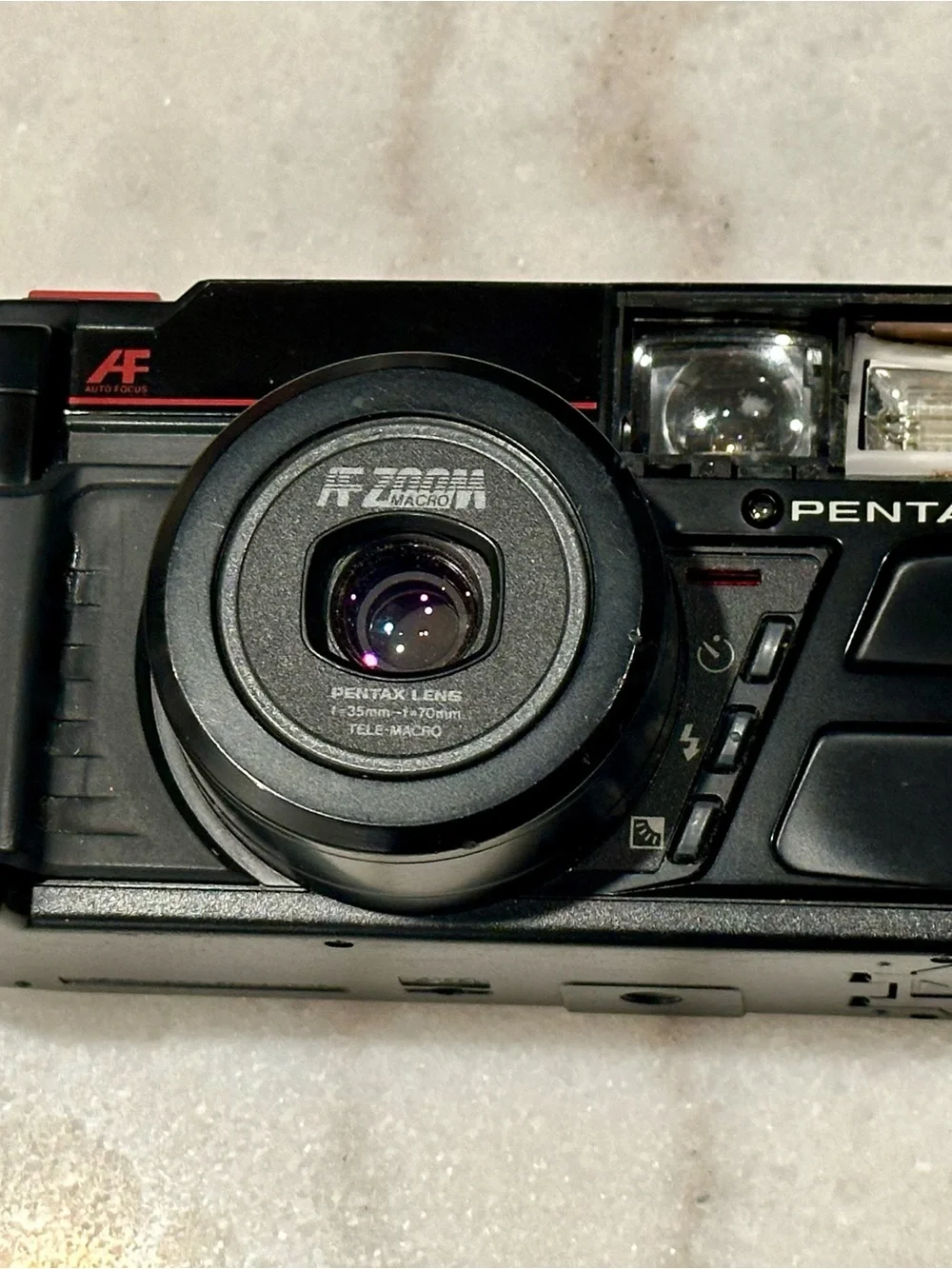 Pentax Black Point-and-Shoot Film Camera with Red-Trim Strap